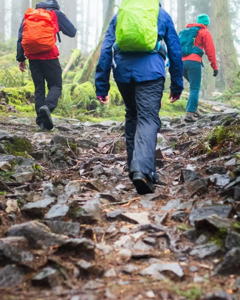 group wearing hiking pants going uphill