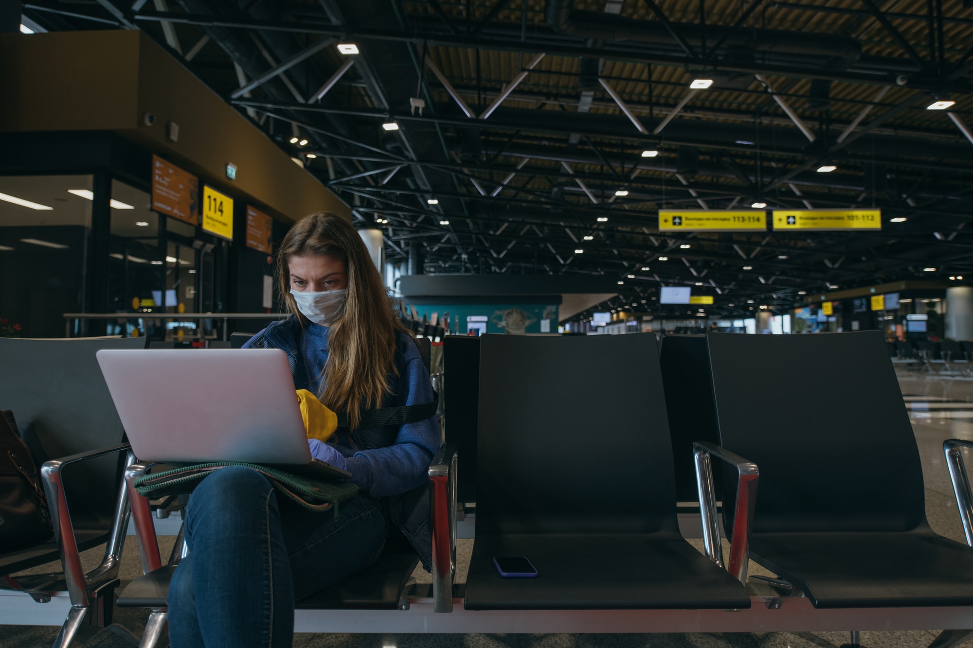 girl at the airport with her laptop